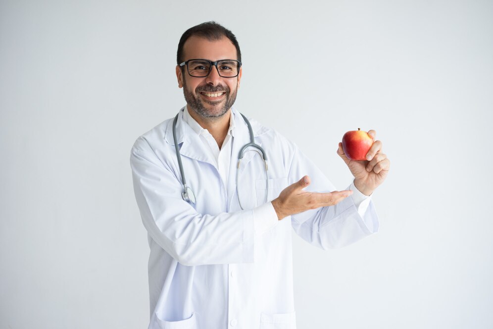 portrait-cheerful-physician-glasses-offering-ripe-apple_1262-12815